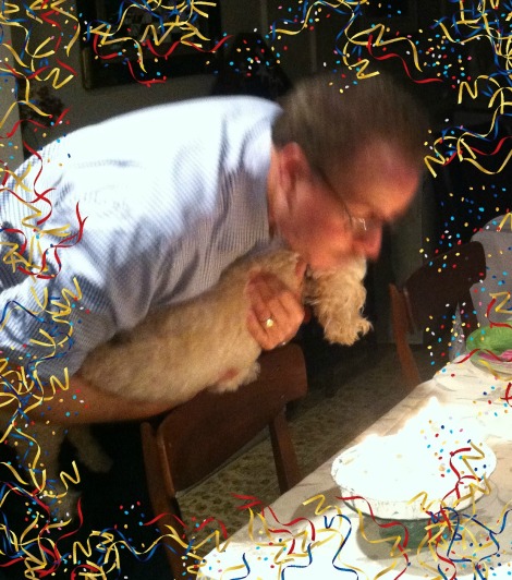 Uncle Bill and his doggy "Brewster" blowing out candles on his birthday cake!